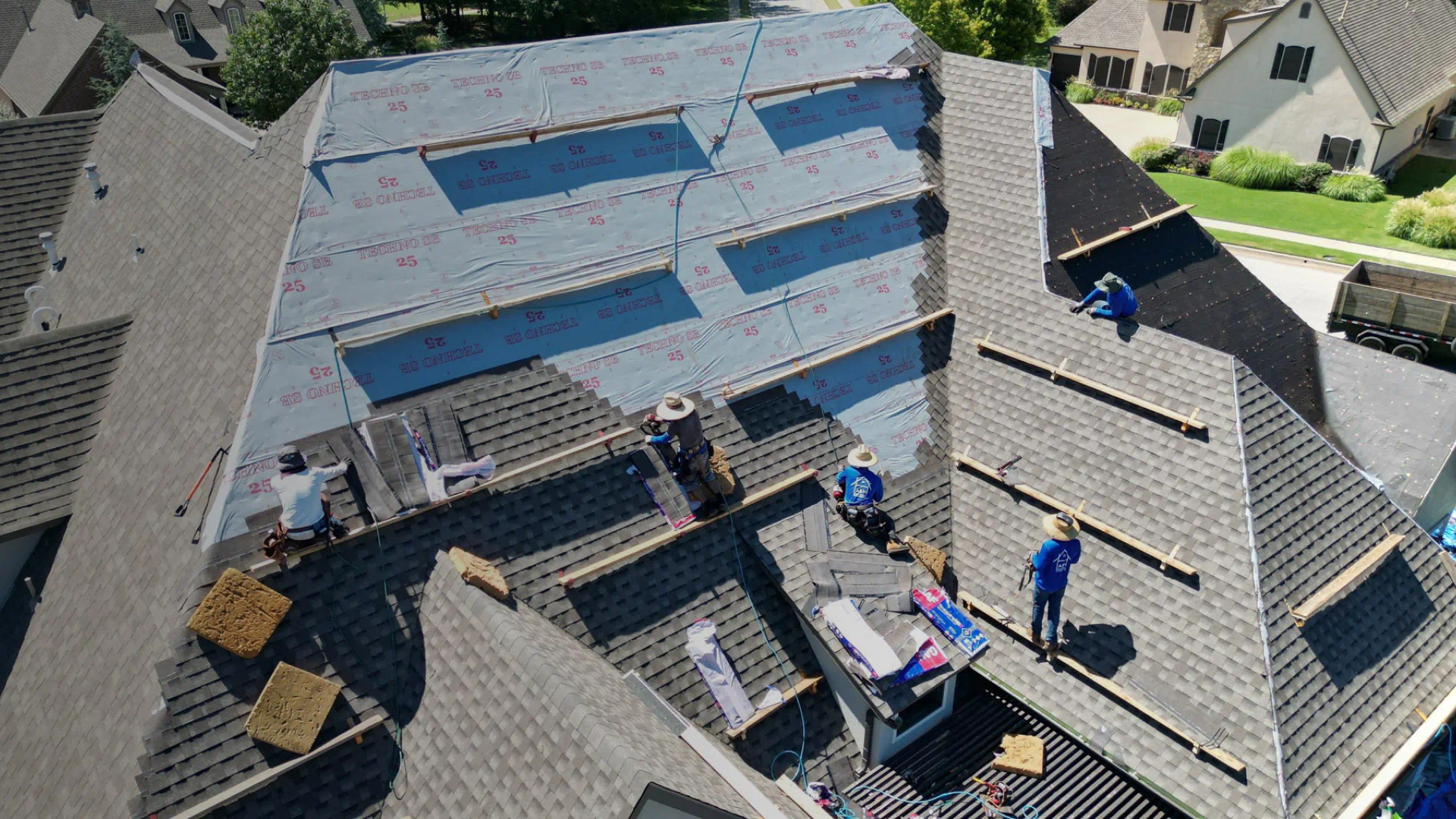 roofing service work in progress roofers installing roof asphalt shingle